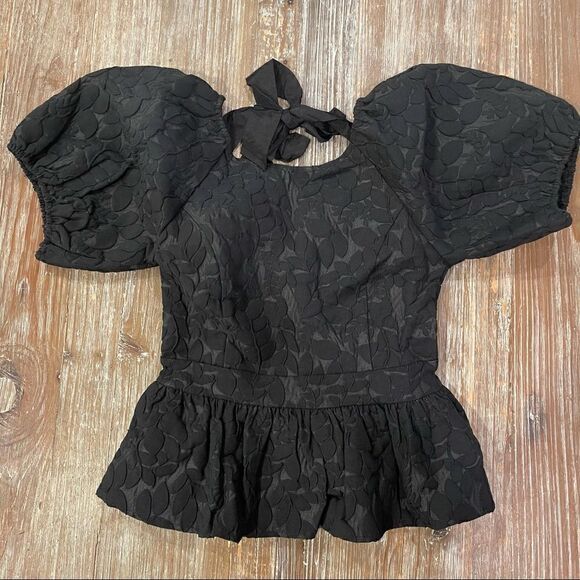 Line + Dot
Delilah Peplum Top  - Picture 6 of 12